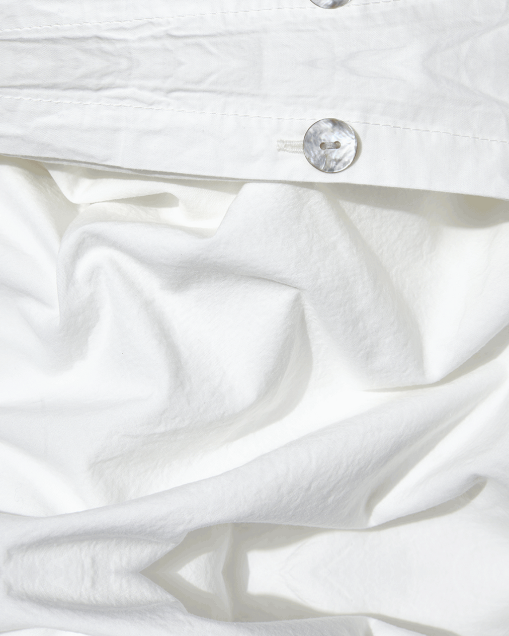 Merci - Parure en percale de coton - Blanc Craie — détail et mise en scène
