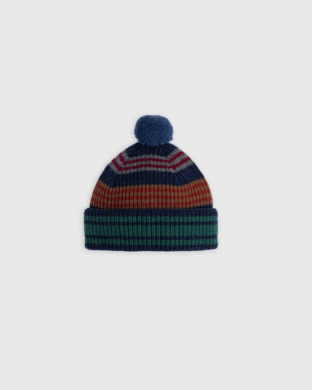 Bonnet à pompon Merci Paris Howlin' en laine d'agneau mérinos marine à rayures multicolores et maille brossée.