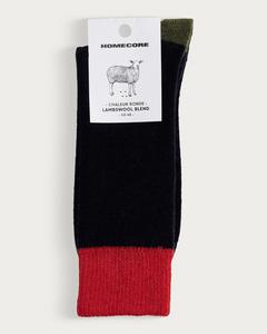 Chaussettes Merci Paris Homecore en laine d'agneau bleu marine avec talon et bordure contrastés rouge et vert
