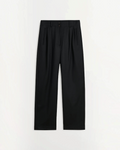 Pantalon large noir Skall Studio en laine avec taille semi-haute et plis, disponible chez Merci Paris