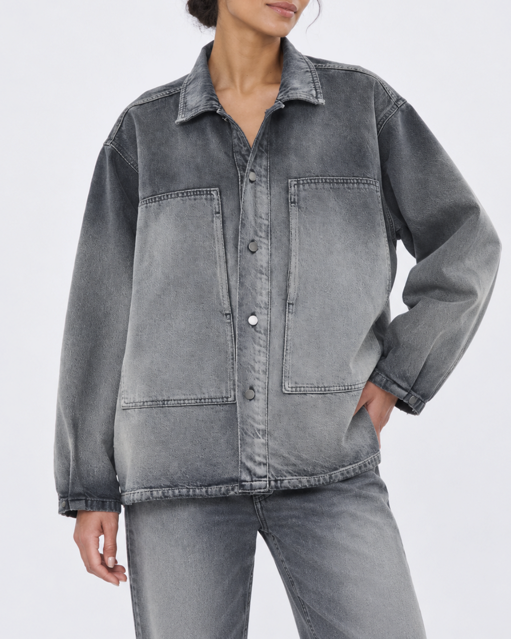 Legacy shirt Haikure in faded gray denim oversize cut with chest pockets, worn by a woman at Merci Paris