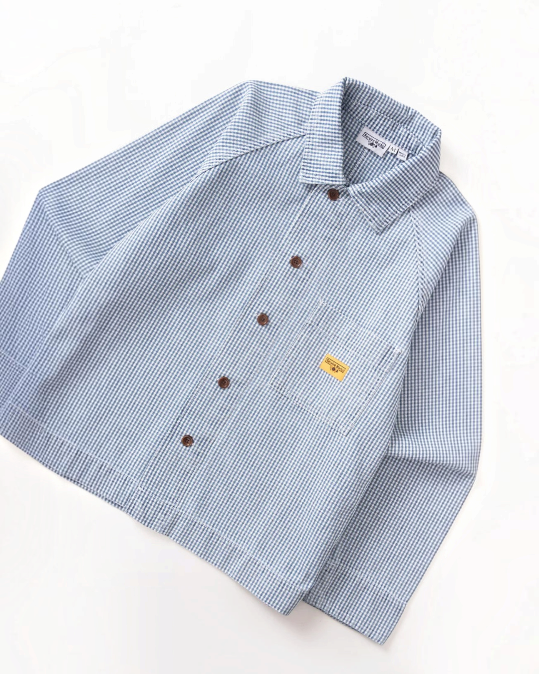 Surchemise Merci Paris Service Works en coton biologique bleu à motif vichy avec poche poitrine et manches raglan