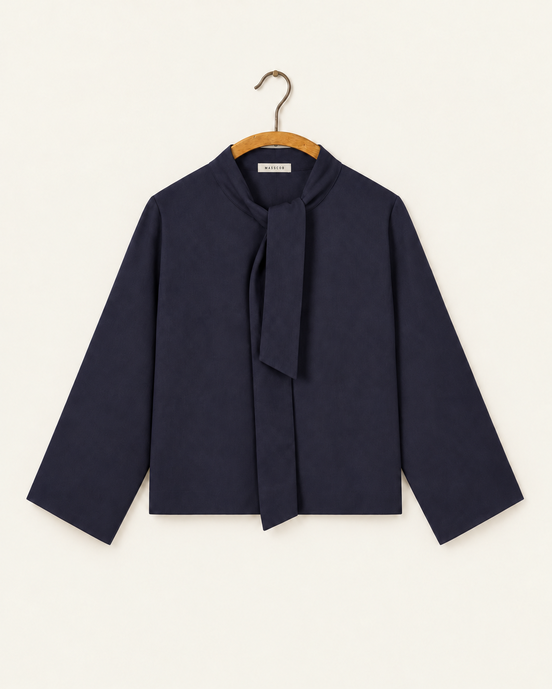 Masscob - Milena navy top on wooden hanger with label Masscob